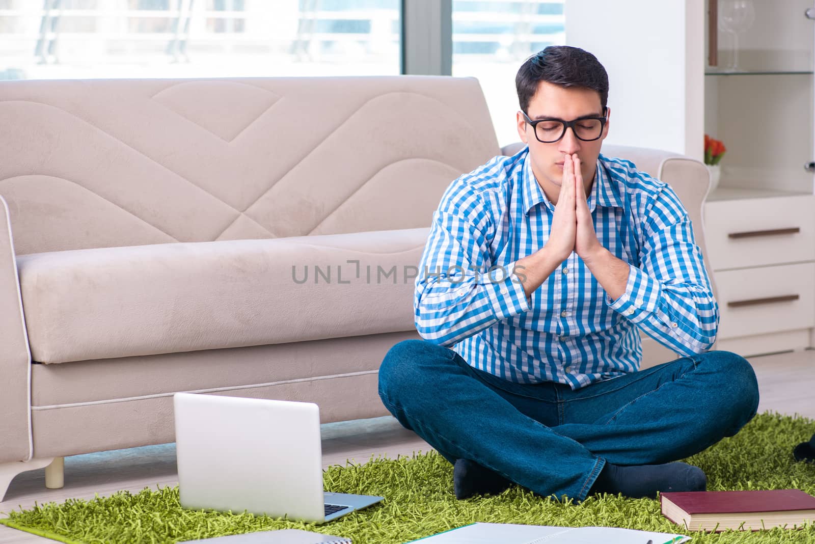 Student meditating and preparing for university exams