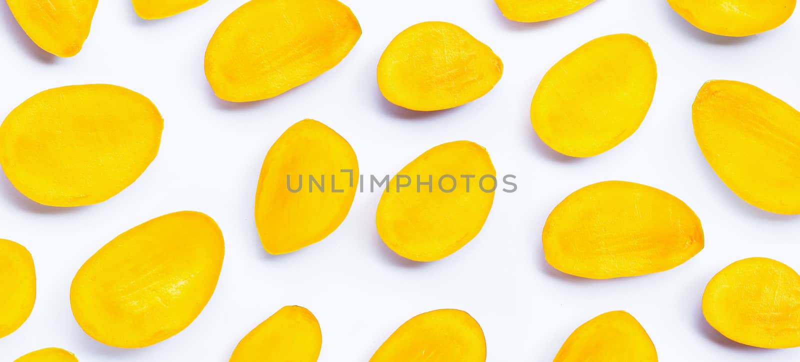 Tropical fruit, Mango slices on white background. Top view