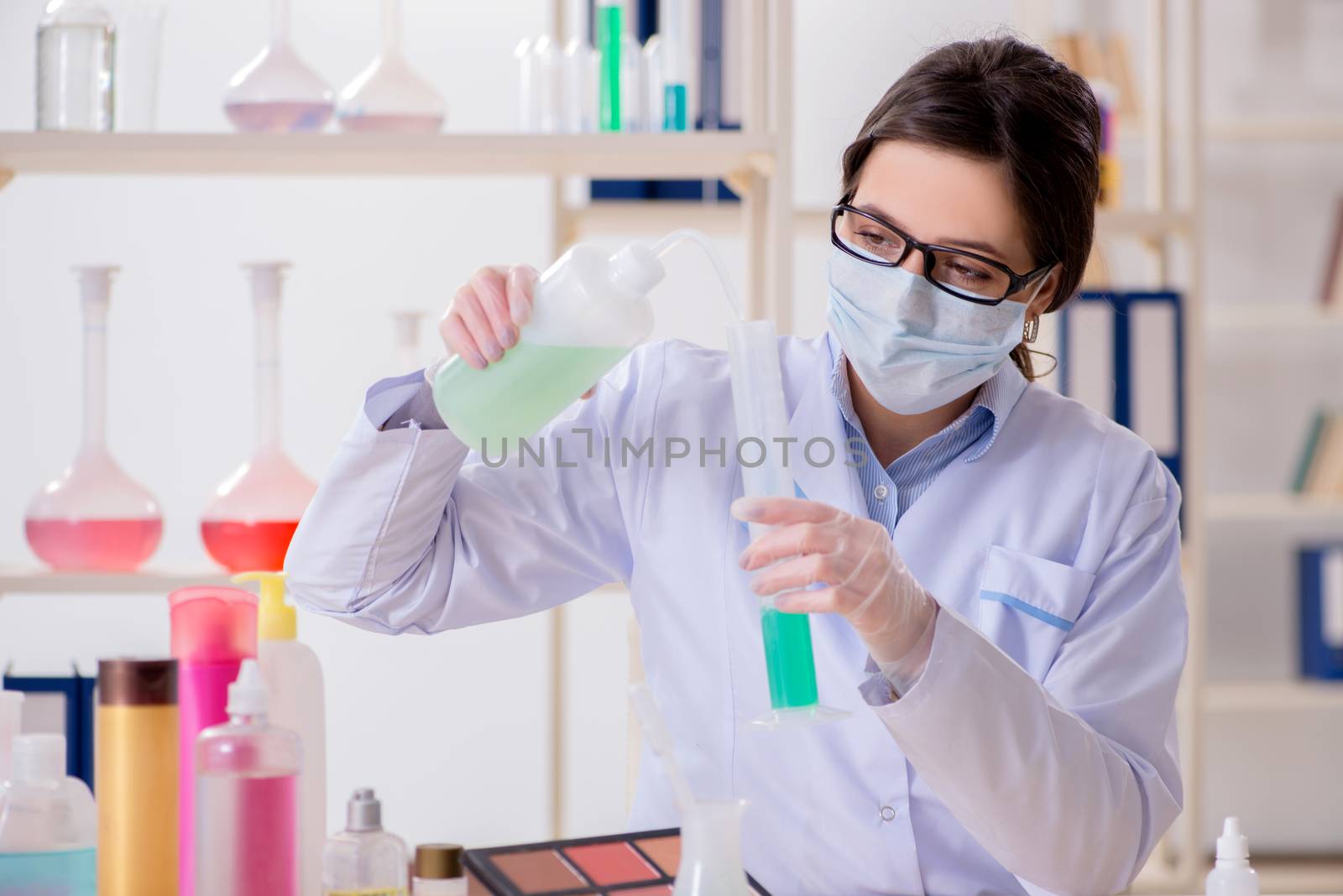 Lab chemist checking beauty and make-up products by Elnur