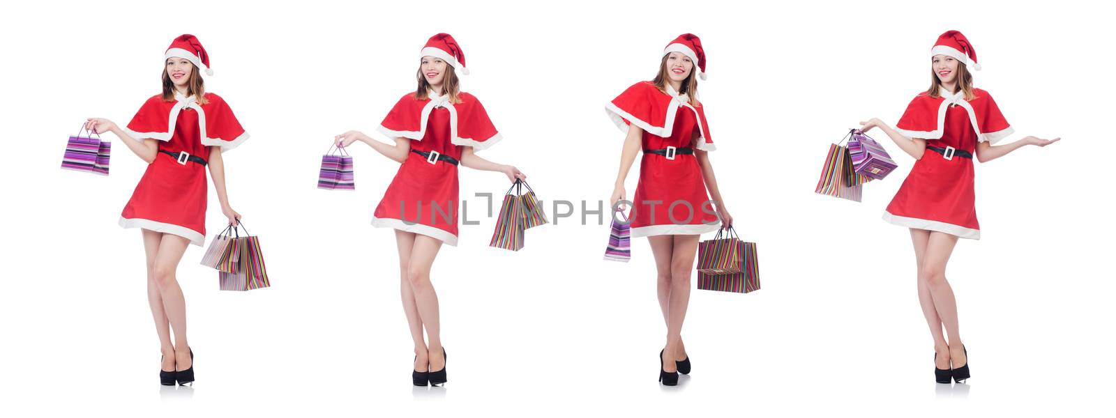 Young woman in red santa costume on white
