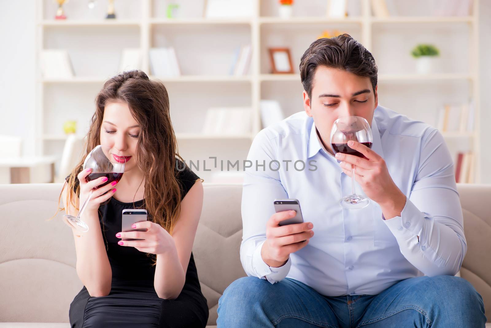 Young pair drinking wine in romantic concept