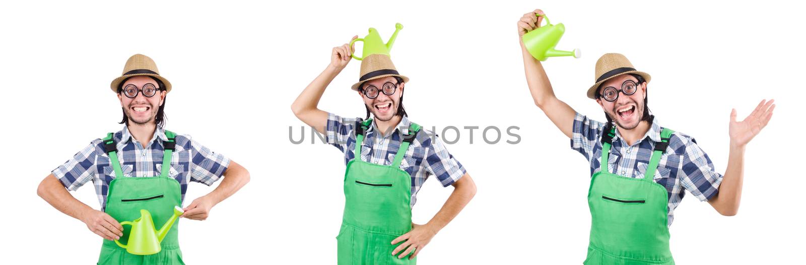 Young cheerful gardener with watering can isolated on white