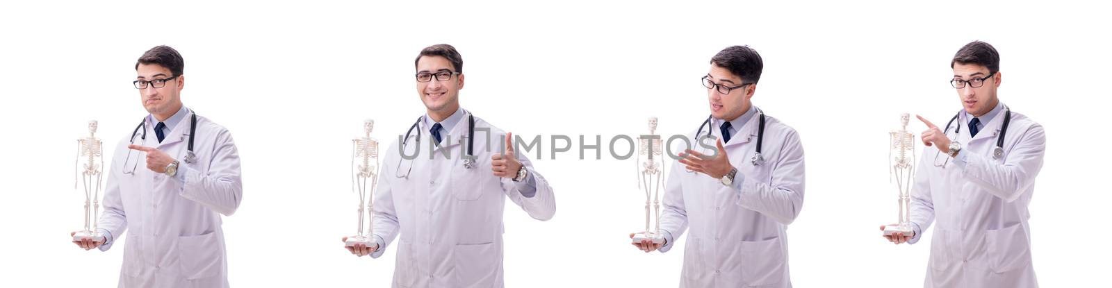 Young male doctor with skeleton isolated on white