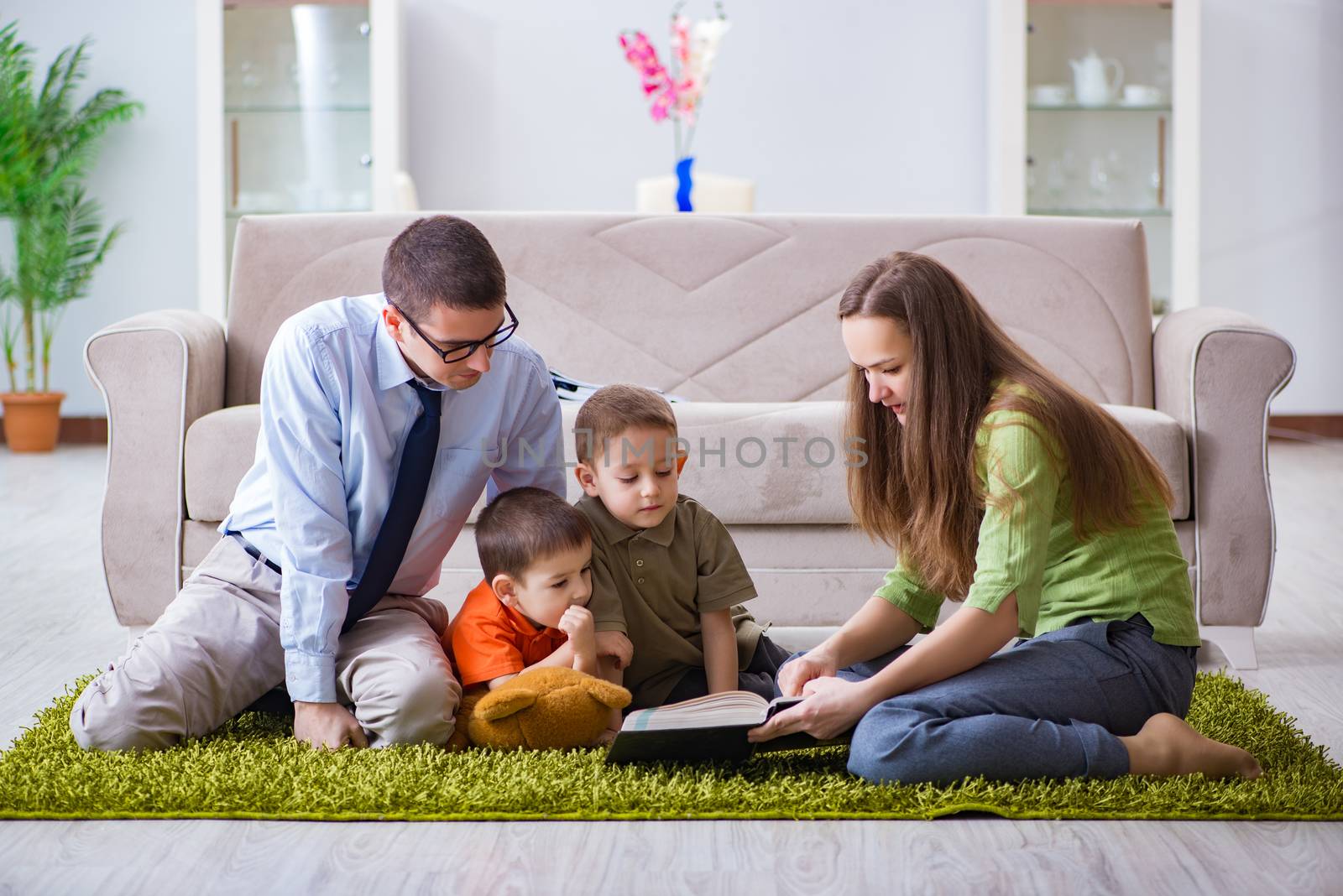 Young family playing in the room at home