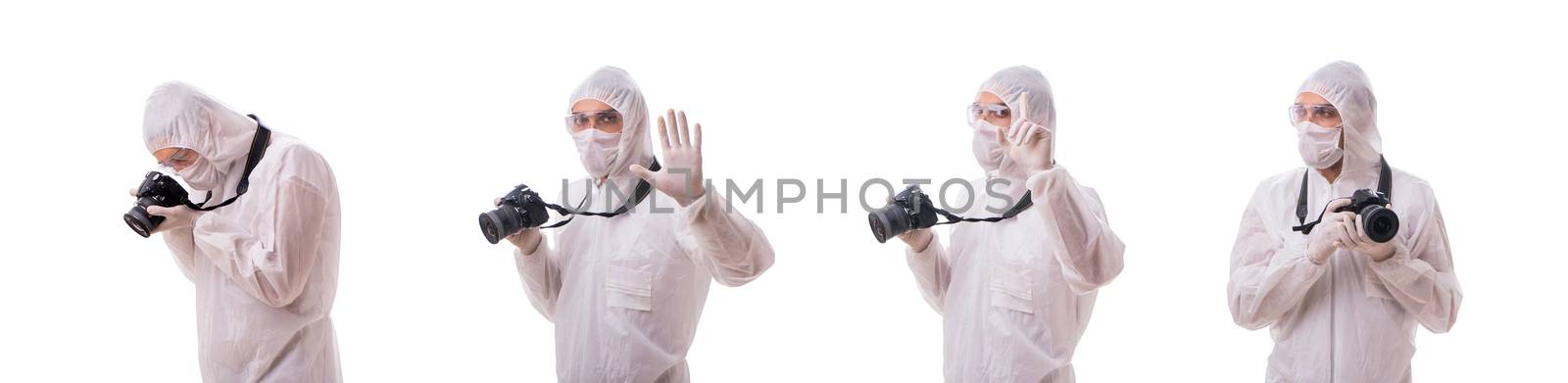 Forensic specialist in protective suit taking photos on white