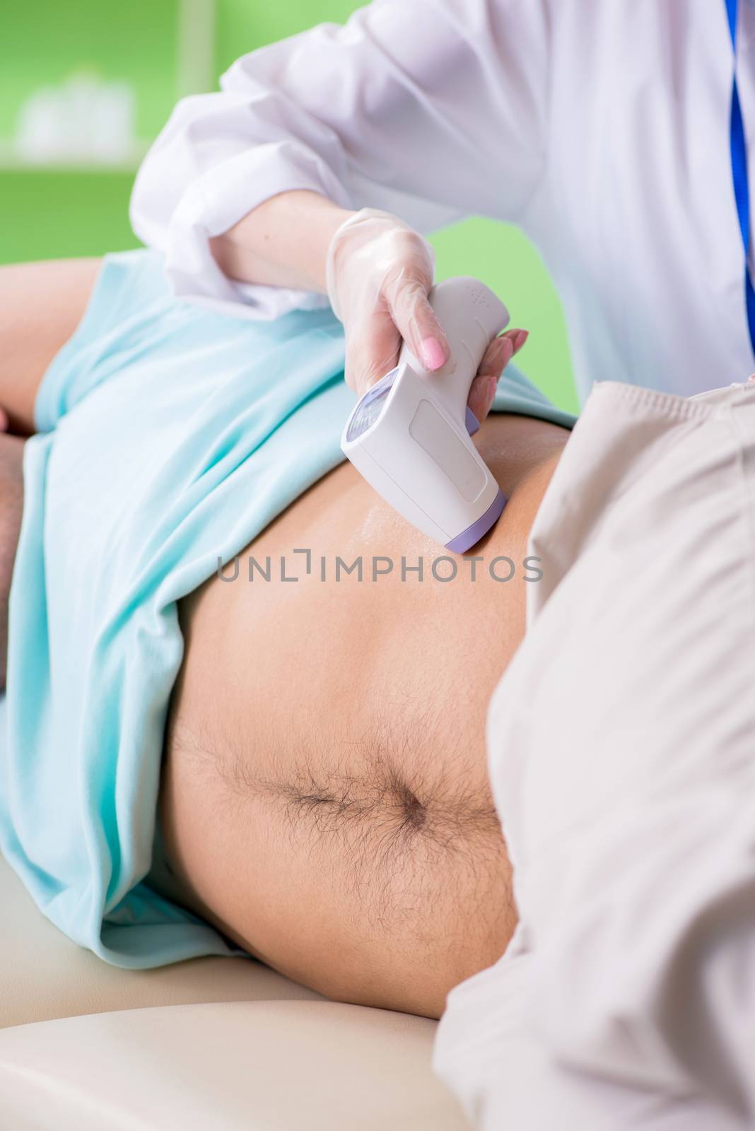 Young man visiting radiologyst for ultrasound procedure 