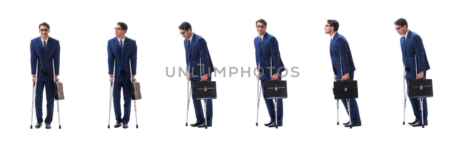 Businessman walking with crutches isolated on white background