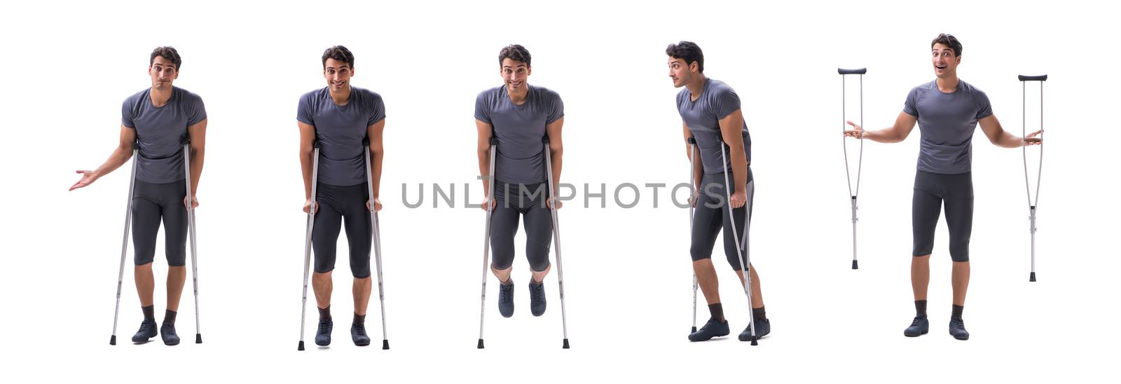 Young patient athlete sportsman suffering an injury trauma with crutches isolated on white