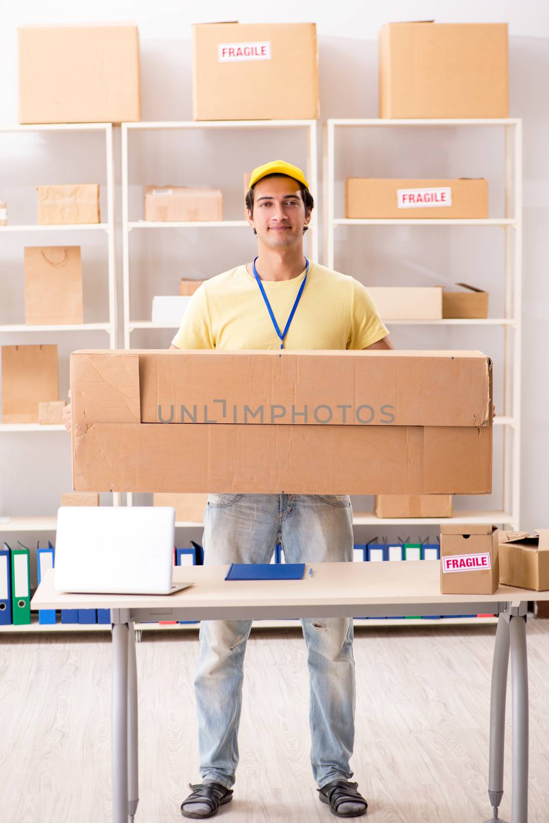 Handsome contractor working in box delivery relocation service 