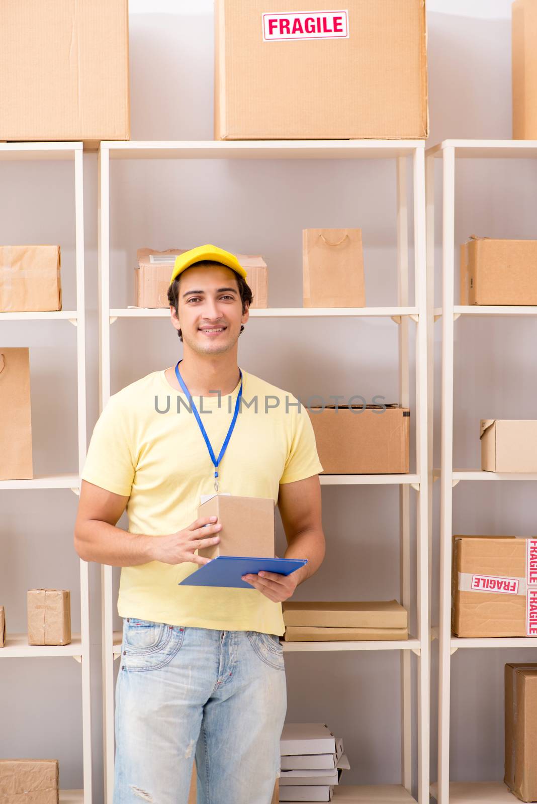 Handsome contractor working in box delivery relocation service 