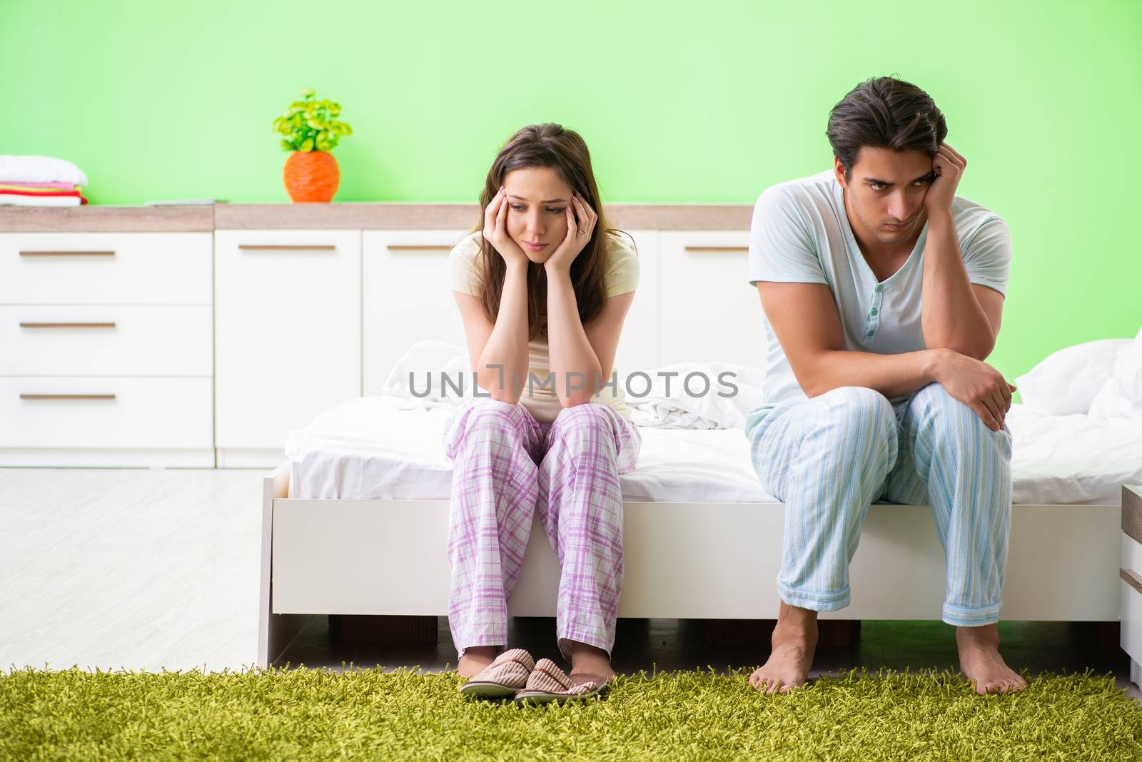 Woman and man in the bedroom after conflict