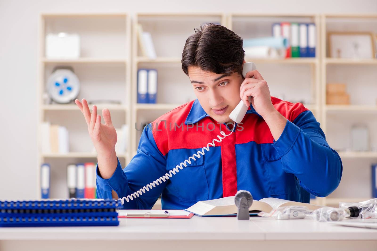 Worker in uniform working on project