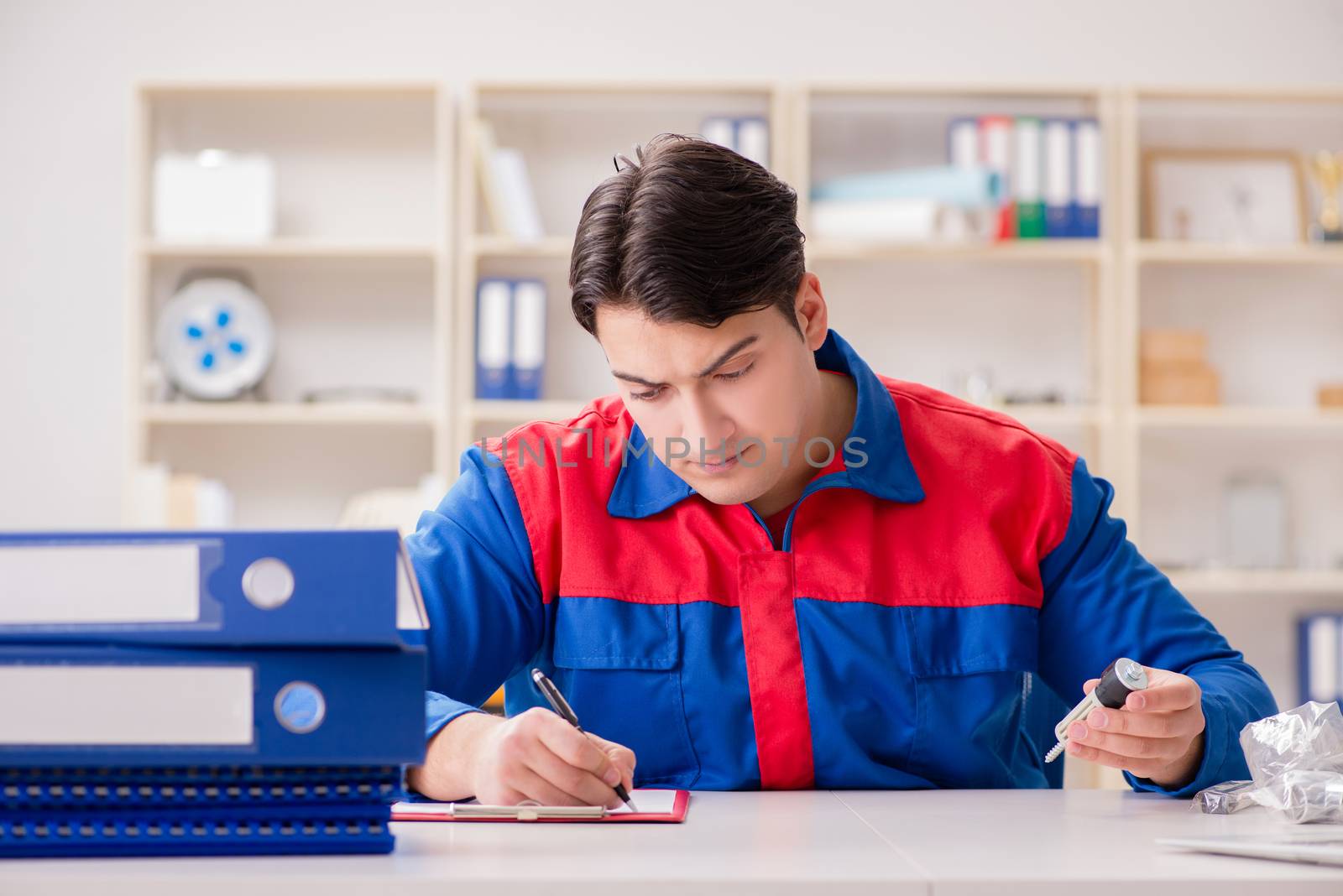 Worker in uniform working on project