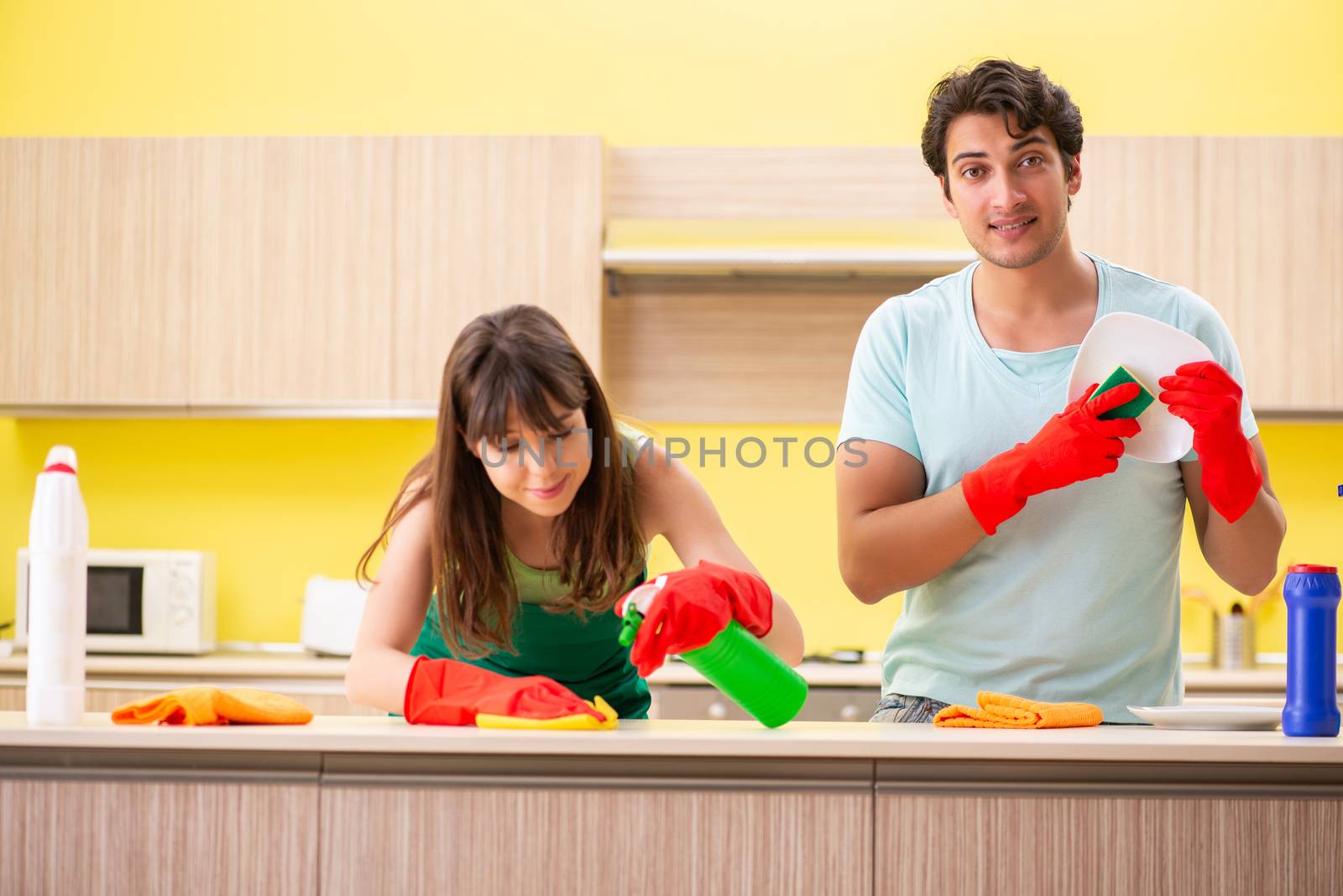 Young couple working at kitchen 