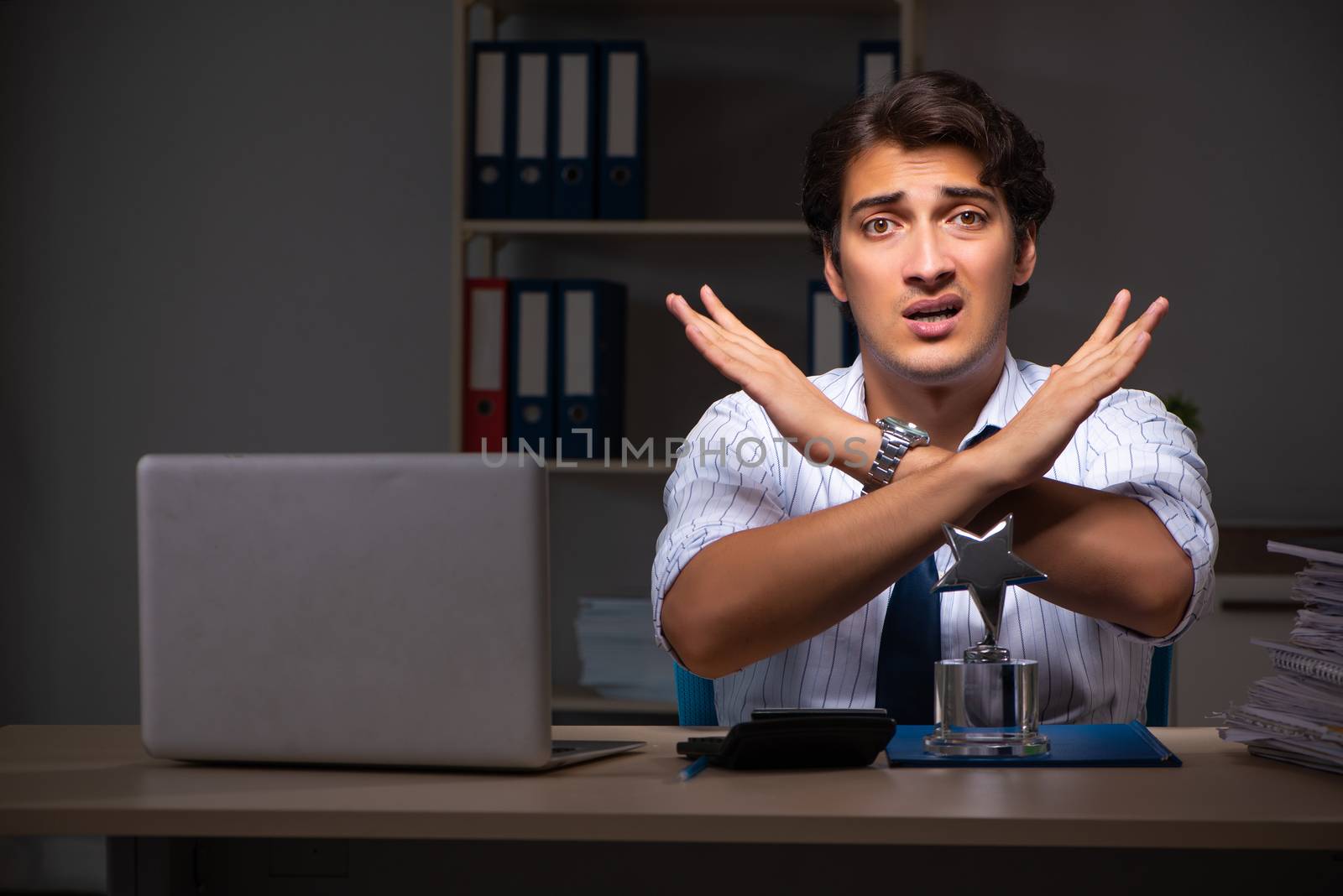 Young financial manager working late at night in office 