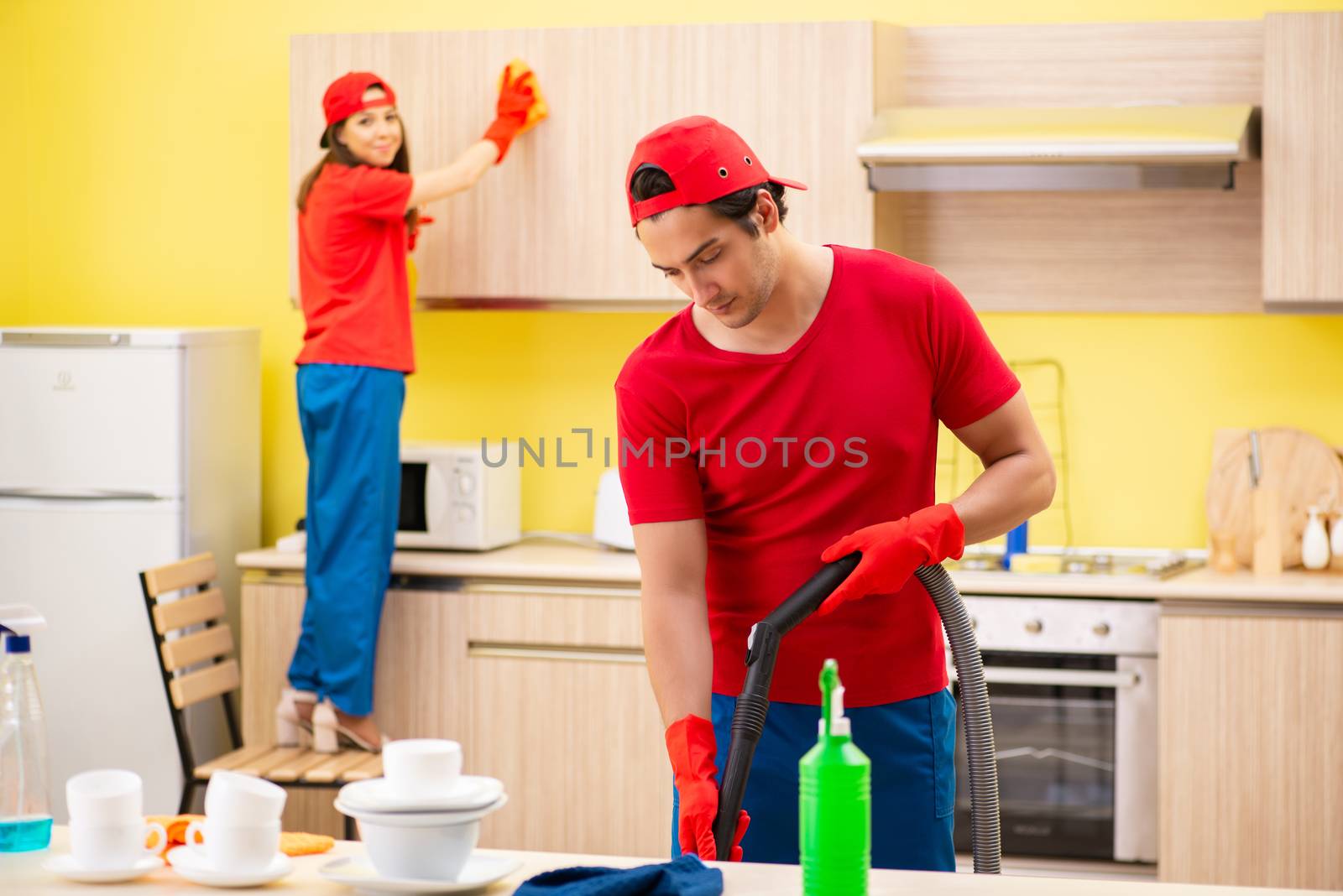 Cleaning professional contractors working at kitchen
