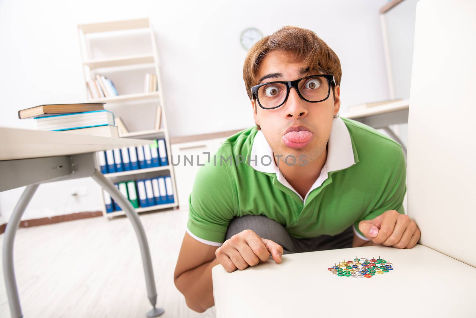 Office prank with sharp thumbtacks on chair