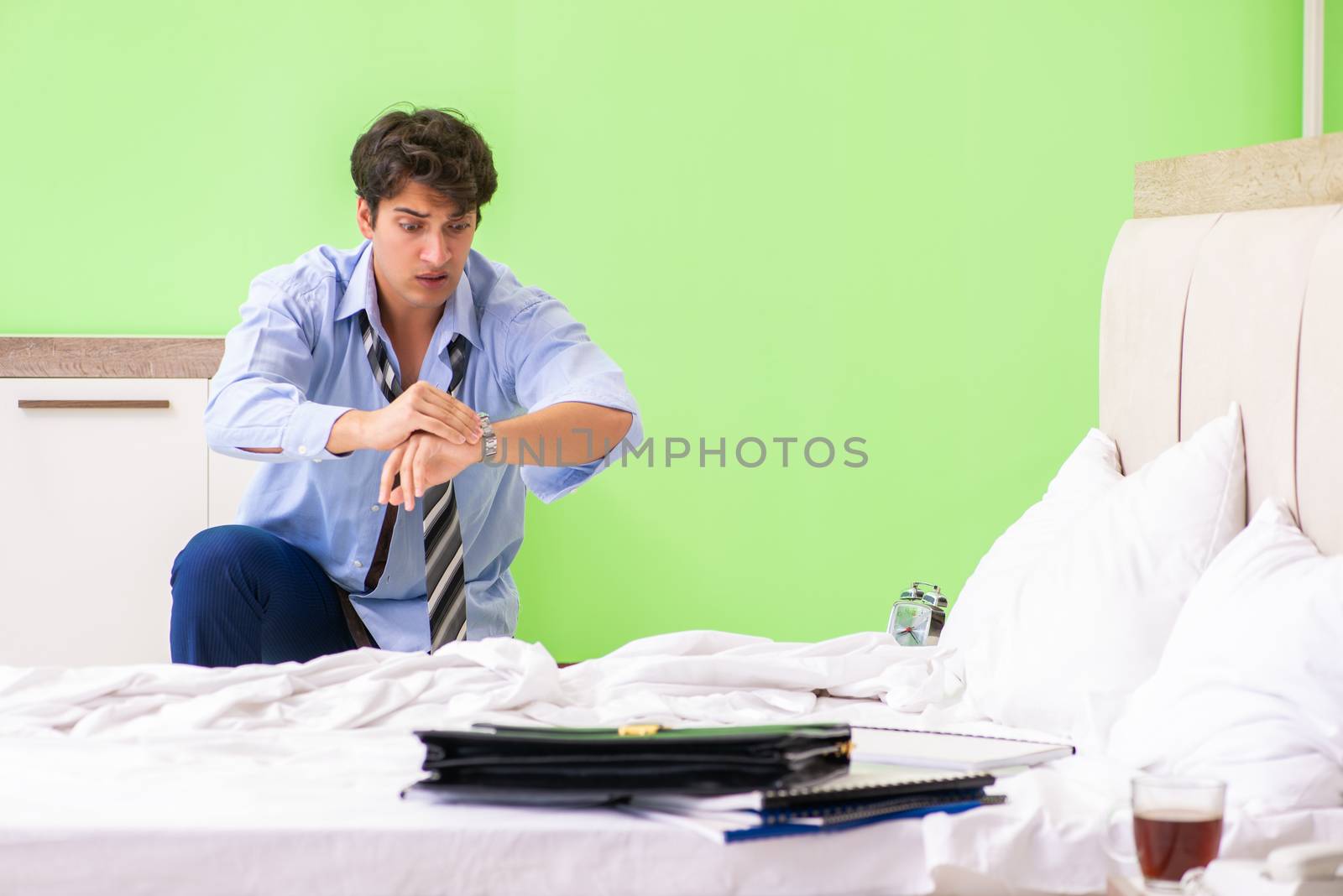 Young businessman employee late for office