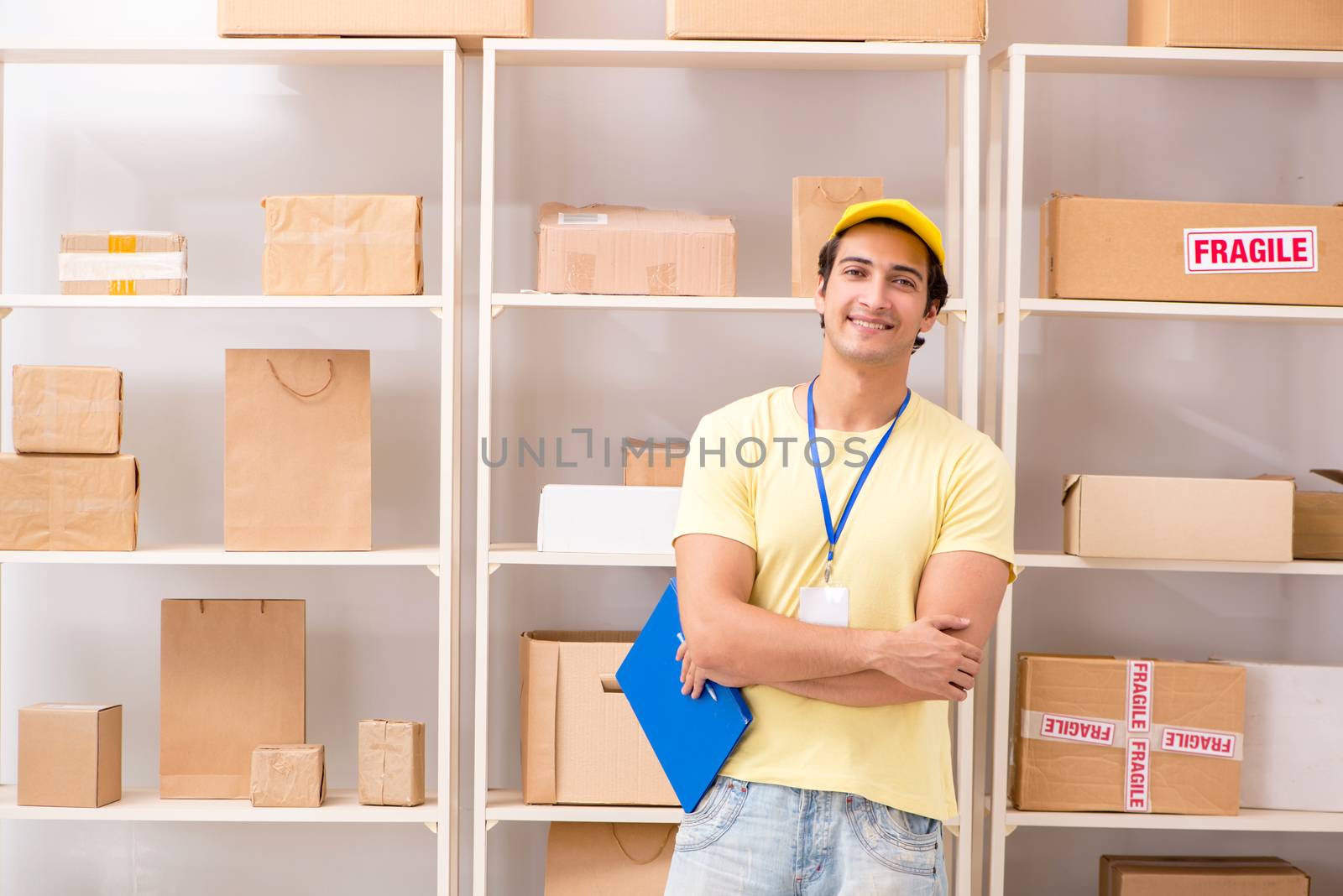 Handsome contractor working in box delivery relocation service 