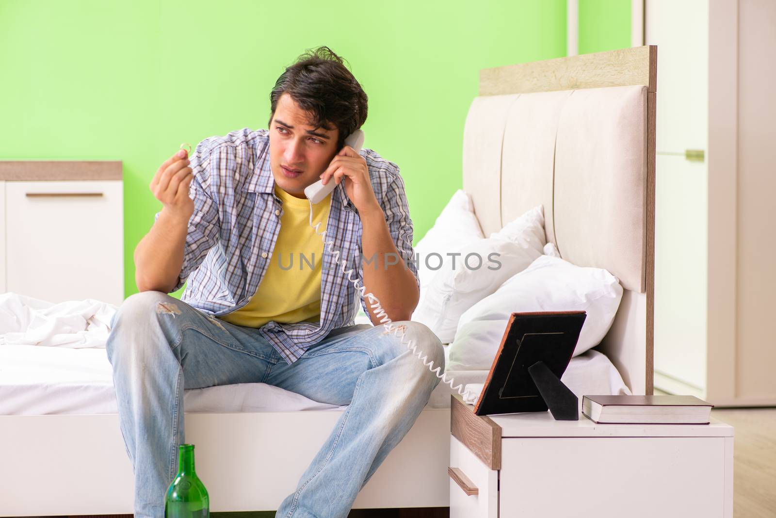 Young man sad in unhappy love concept