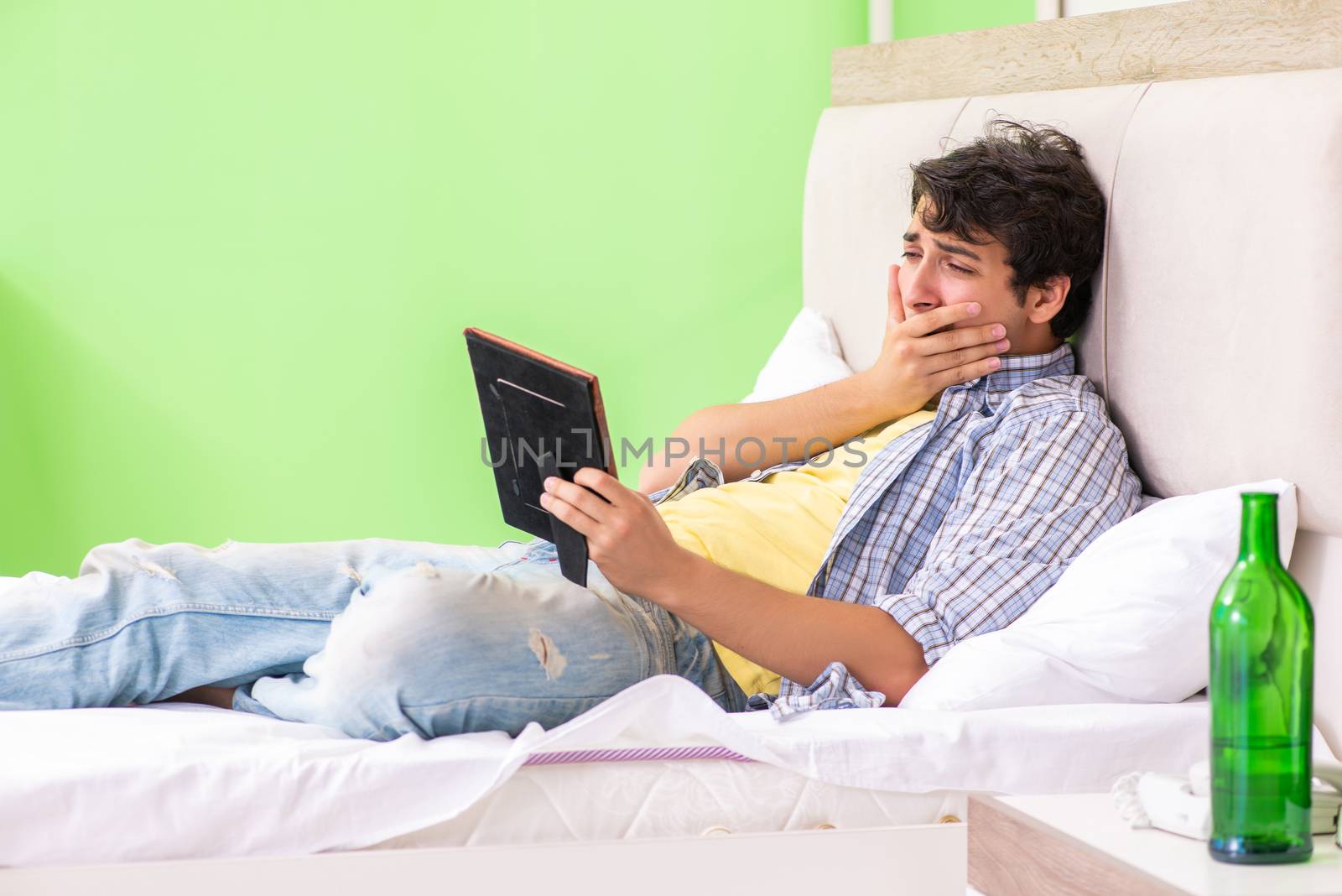 Young man sad in unhappy love concept