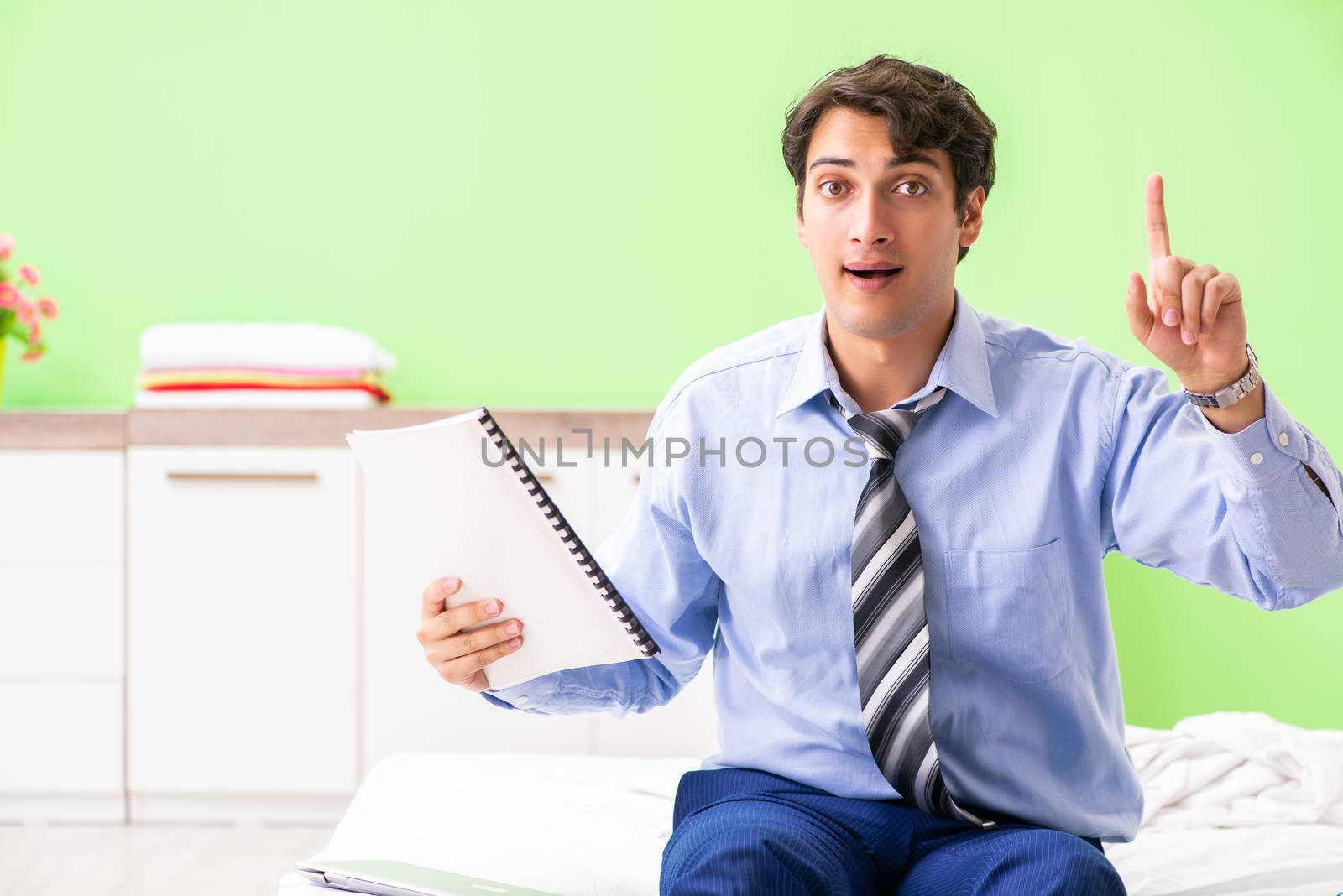 Businessman working overtime in hotel room