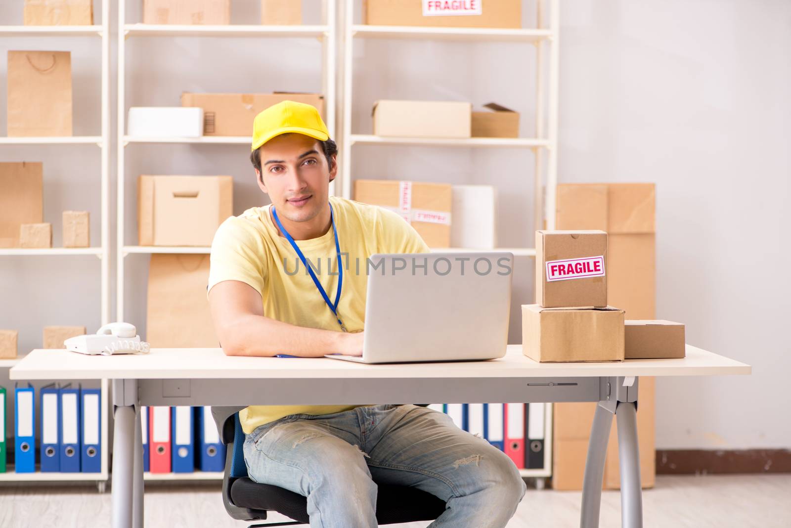 Handsome contractor working in box delivery relocation service 