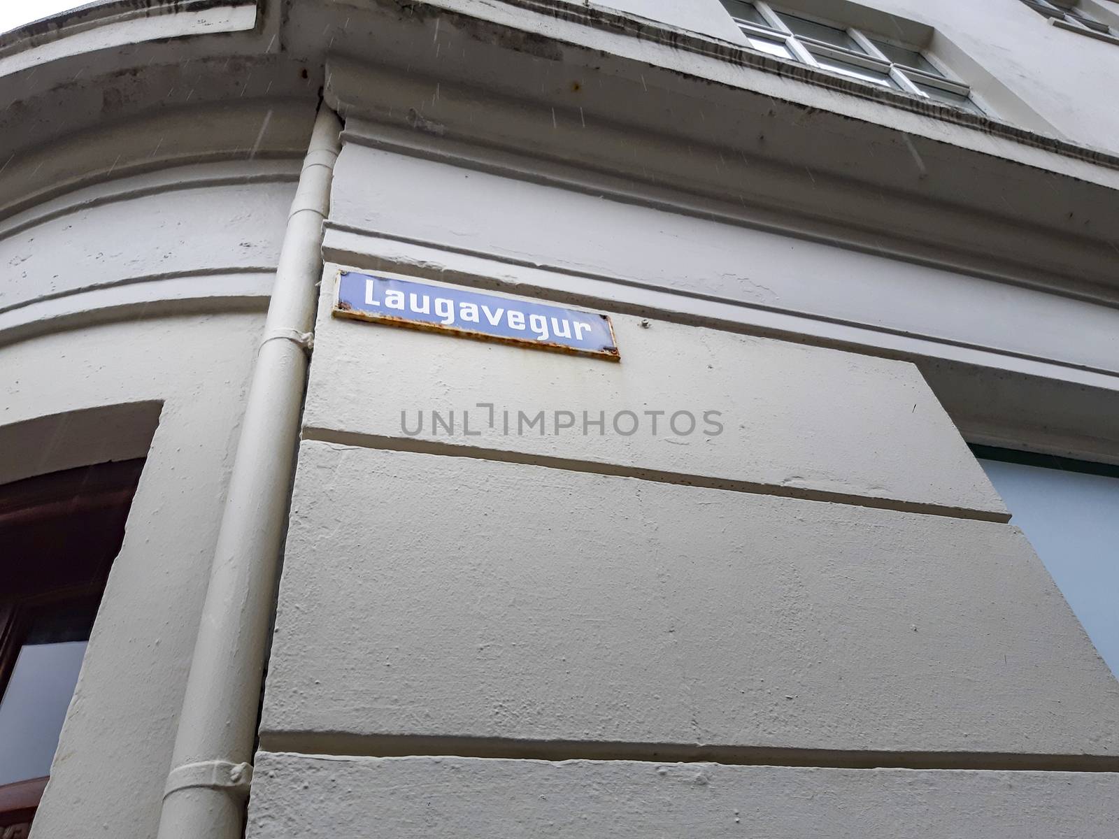 Laugavegur street sign on the wall of a house. Famous shopping street in Reykjavik, Iceland. by kb79
