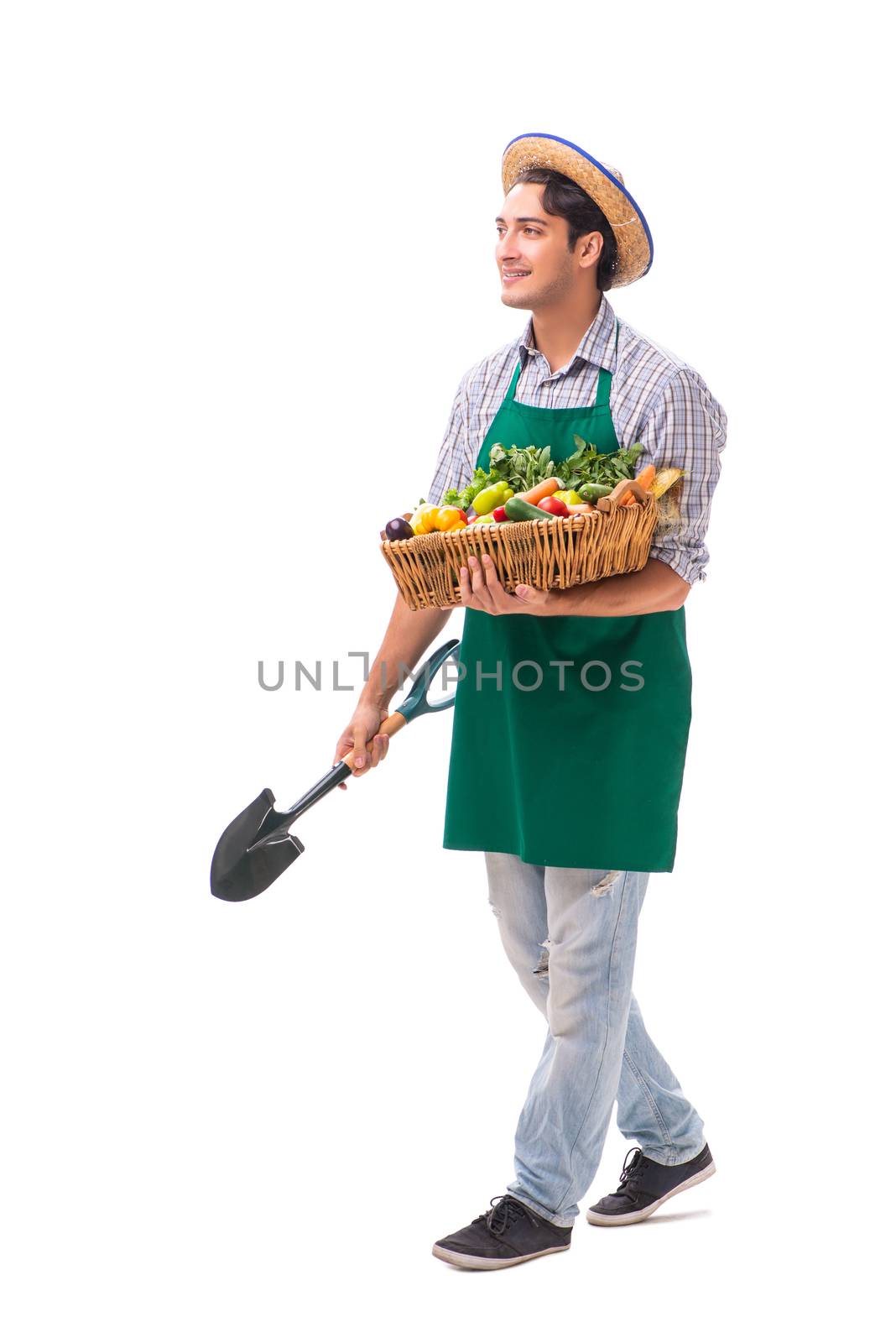 Young farmer with fresh produce isolated on white background