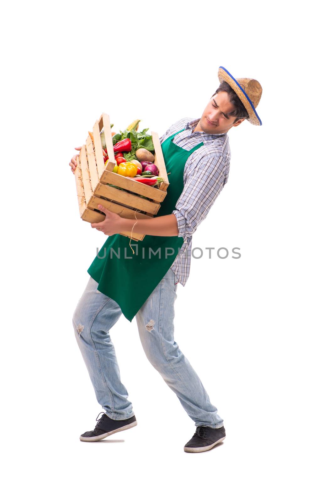 Young farmer with fresh produce isolated on white background