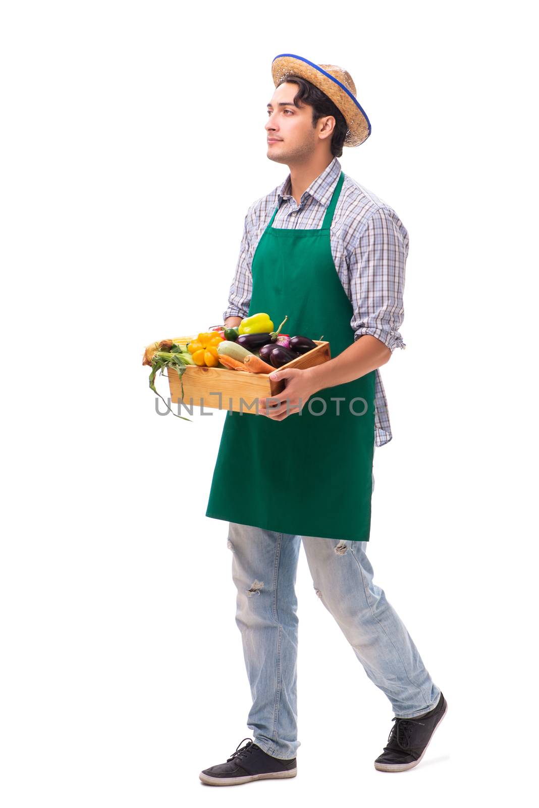 Young farmer with fresh produce isolated on white background