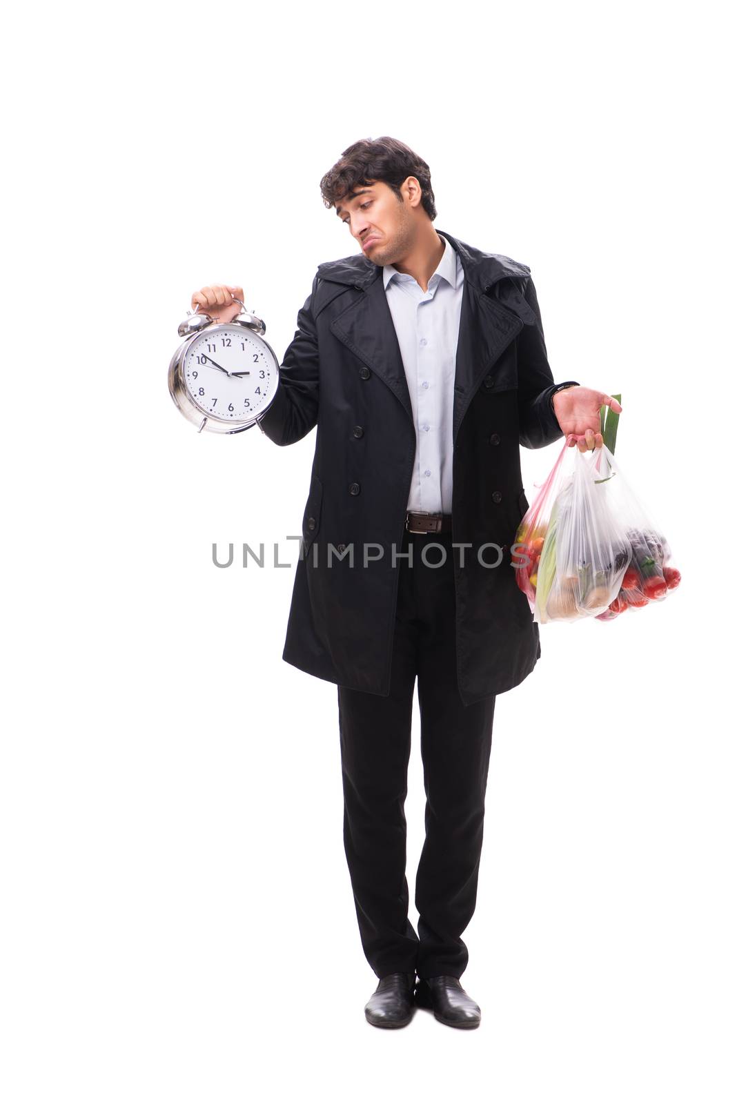 Young handsome man with vegatables in shopping concept 