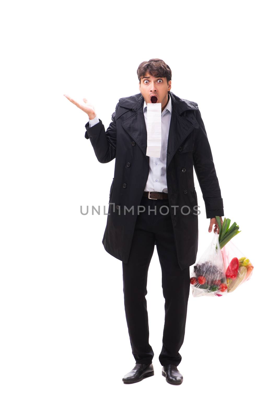 Young handsome man with vegatables in shopping concept 