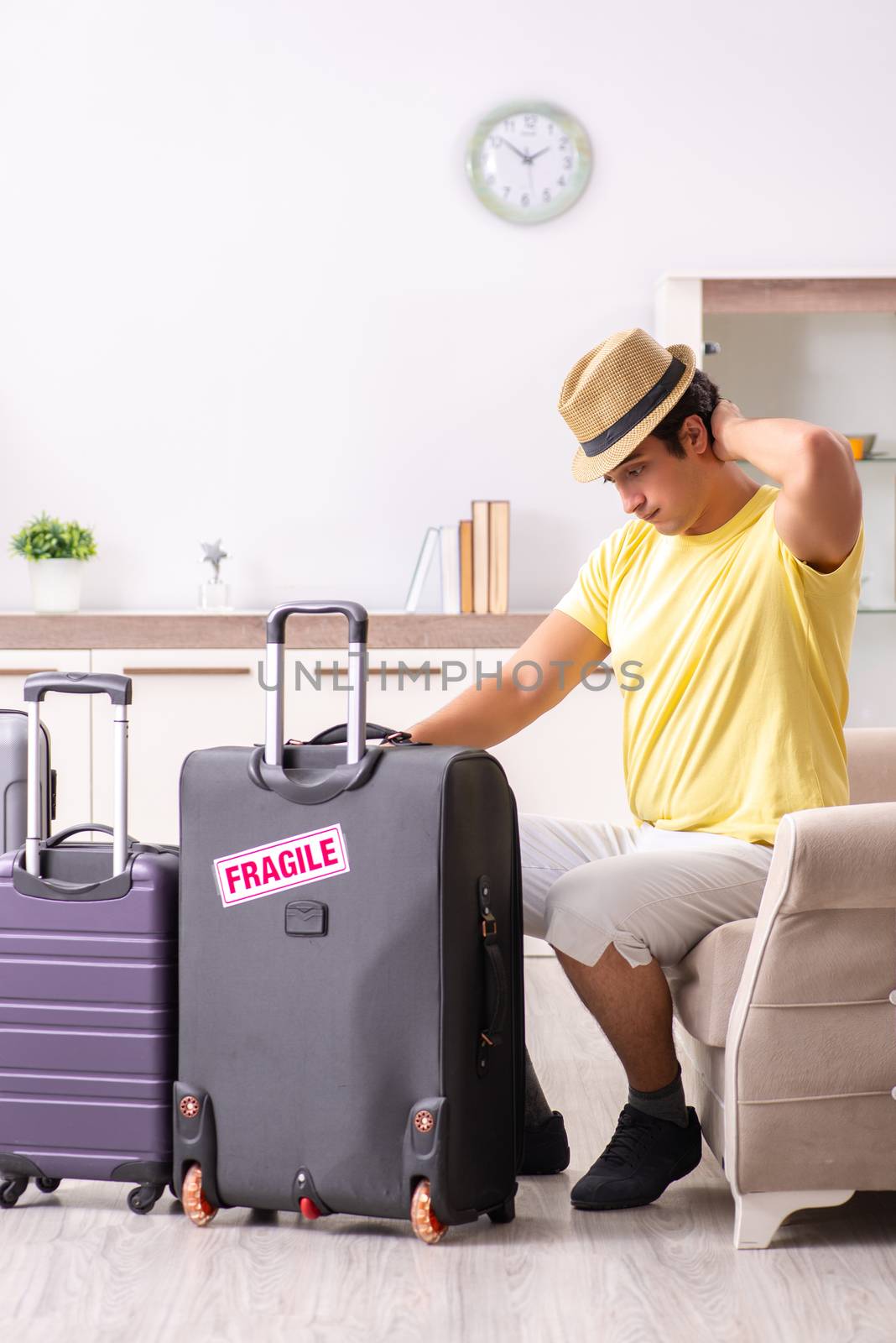 Man going on vacation with fragile suitcases