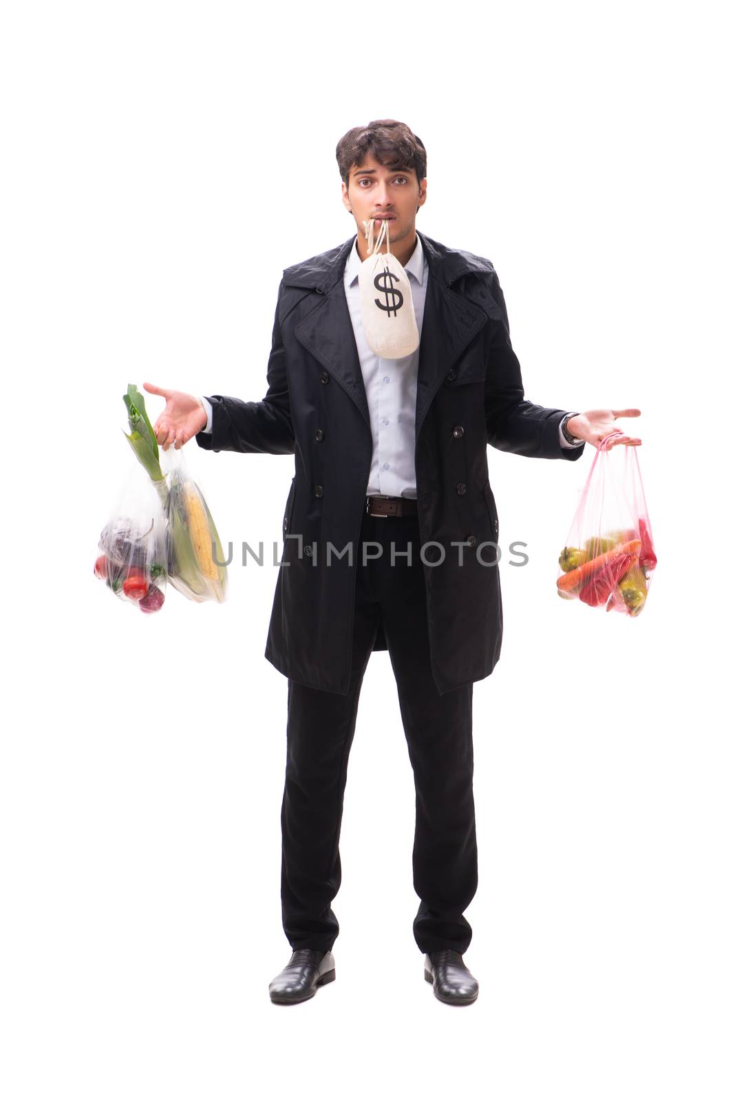 Young handsome man with vegatables in shopping concept 