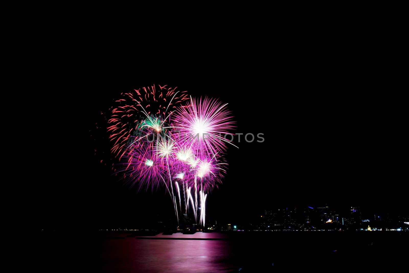 Fireworks on the sky at sea with beautiful of colors.