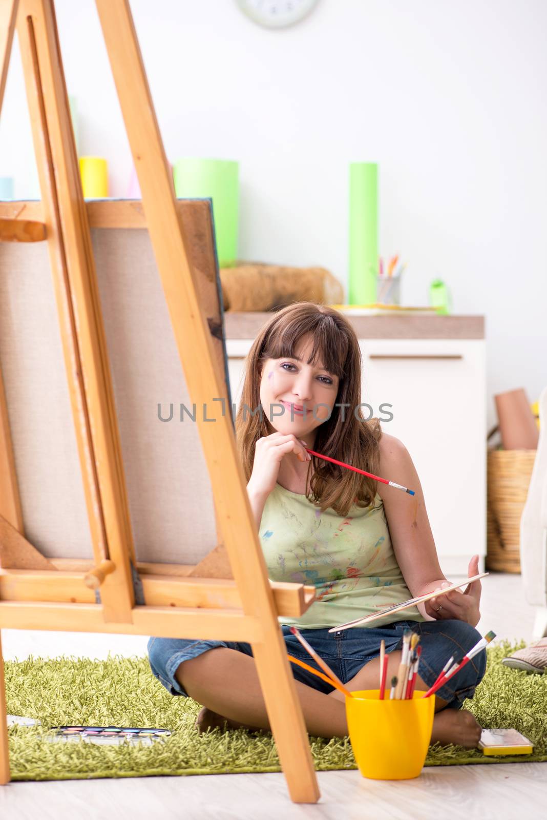 Young couple enjoying painting at home