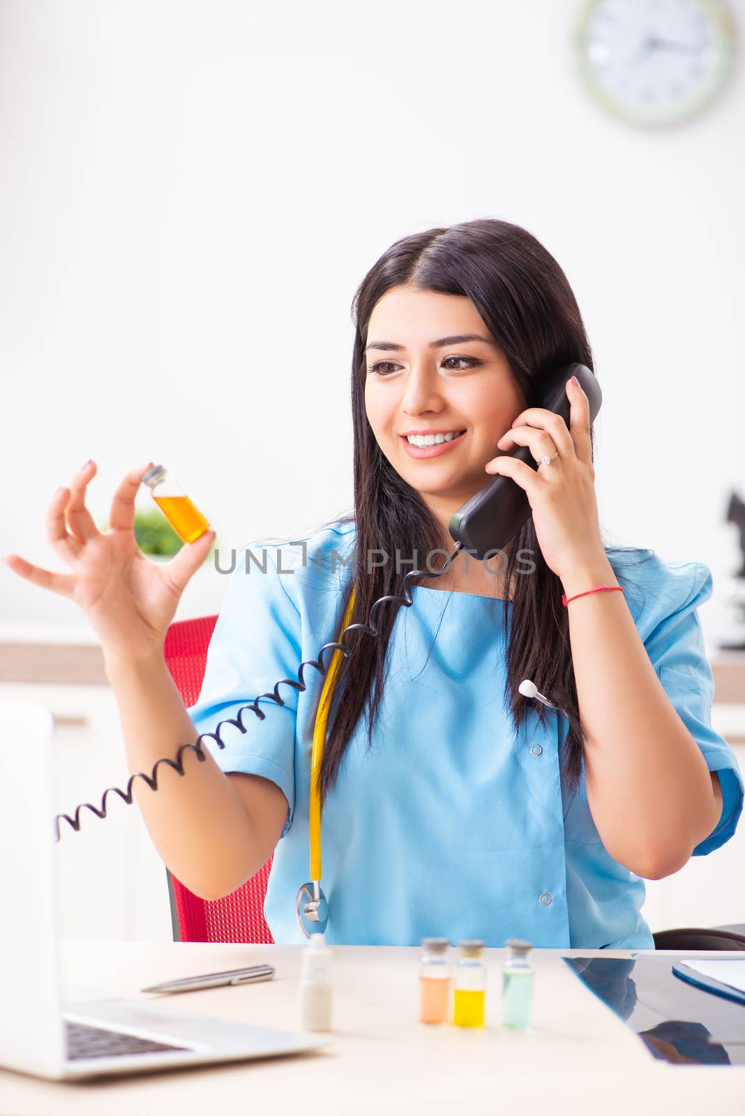 Young beautiful female doctor working in the clinic 