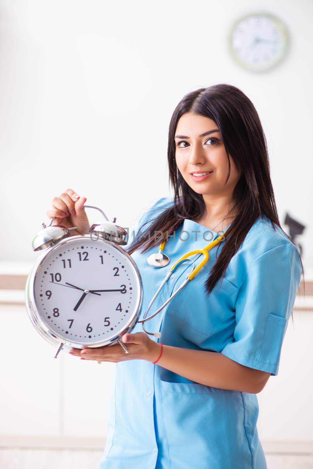 Young beautiful female doctor working in the clinic 