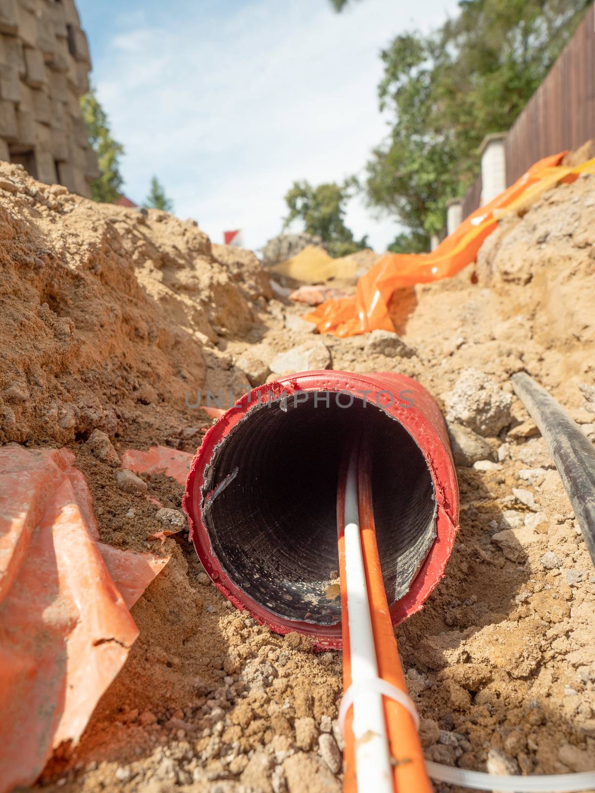 Data fiber optic cables in ribbed pipe under road by rdonar2