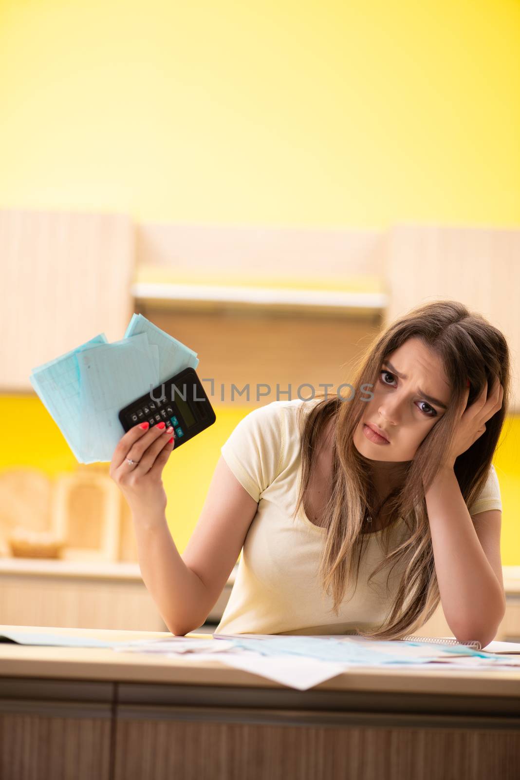 Young woman wife in budget planning concept