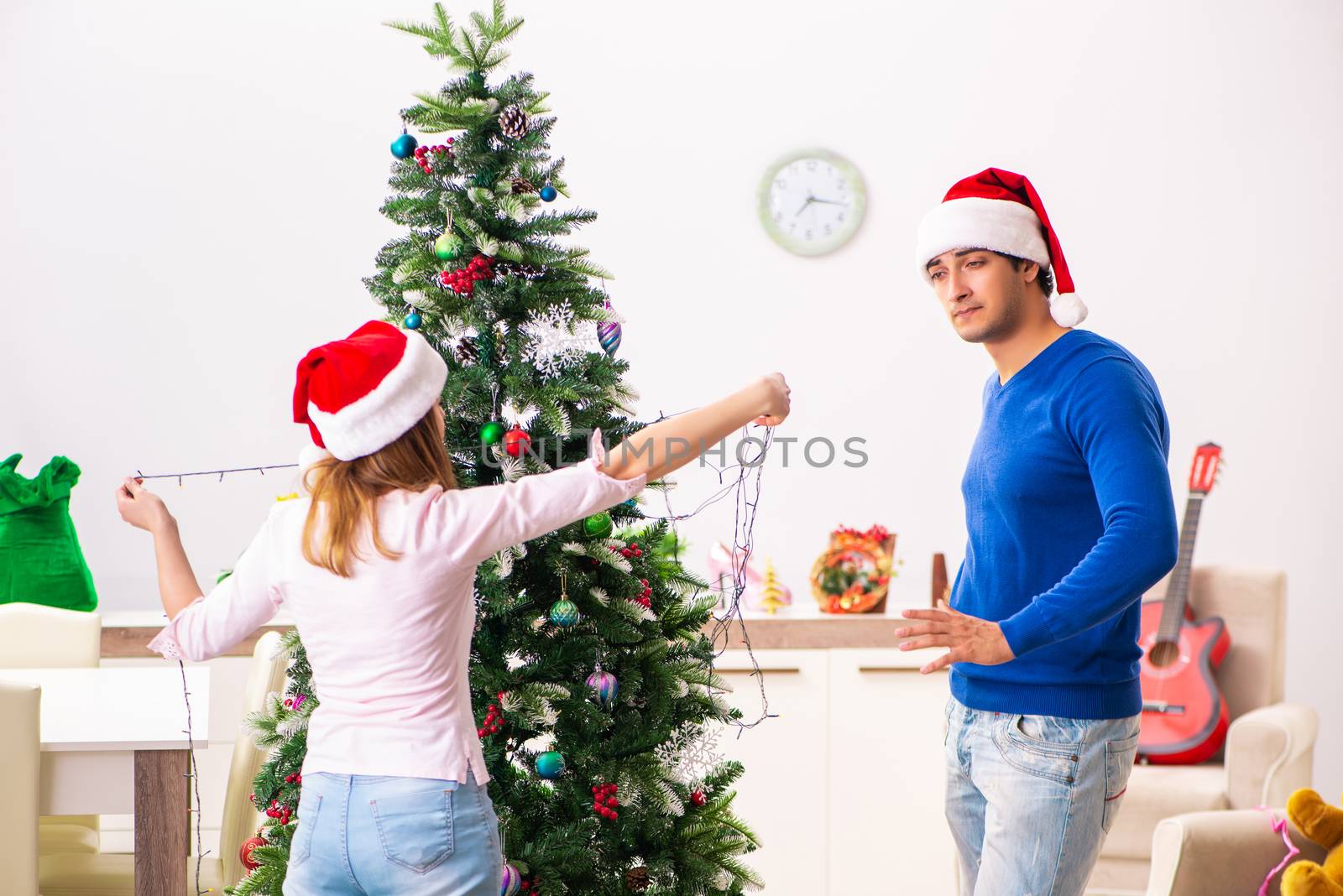 Young family celebrating christmas at home