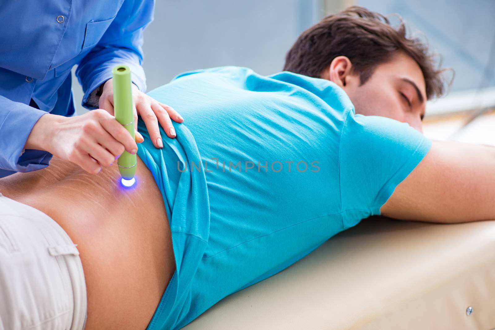 Patient in clinic undergoing laser scar removal