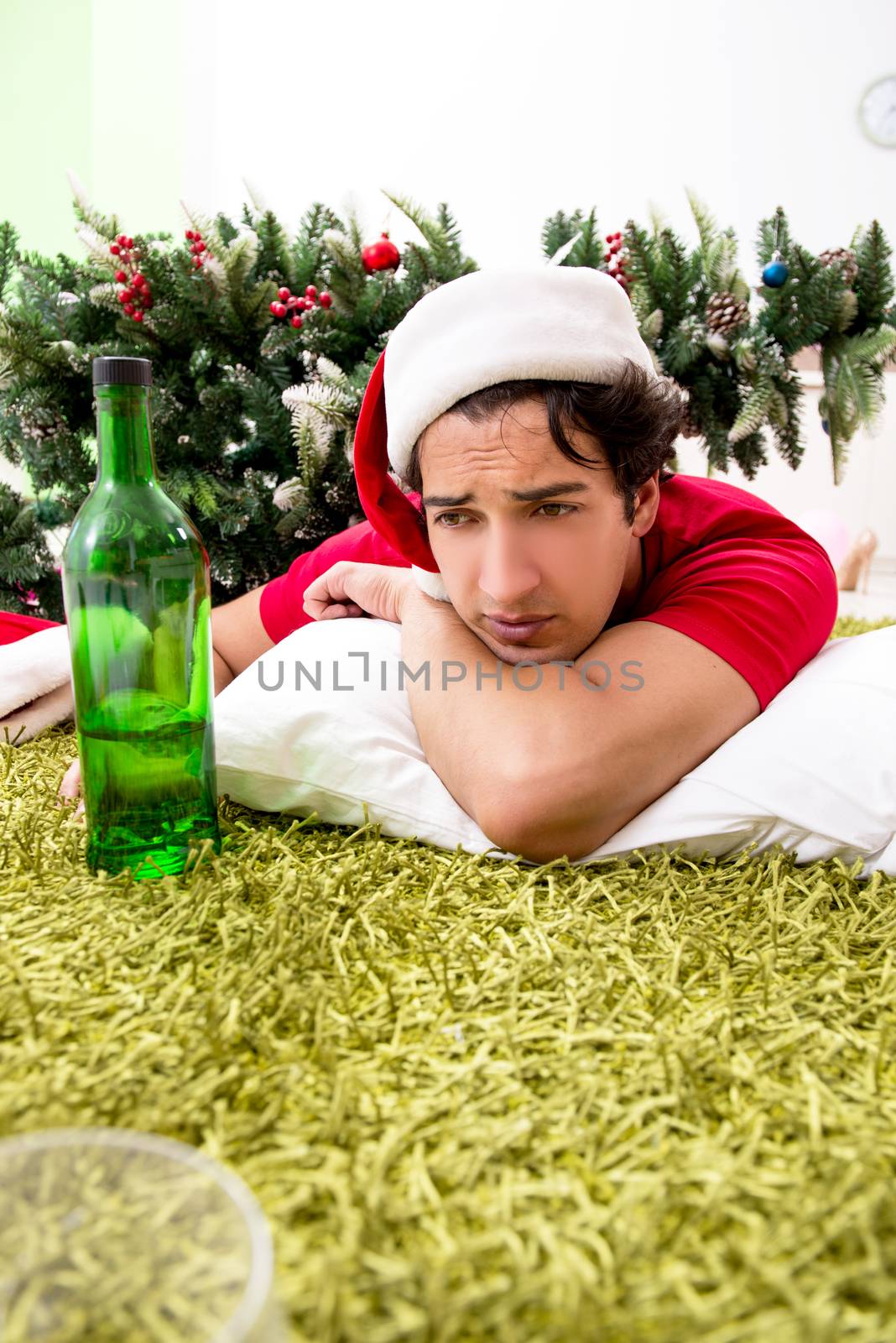 Young man drunk at home after christmas party