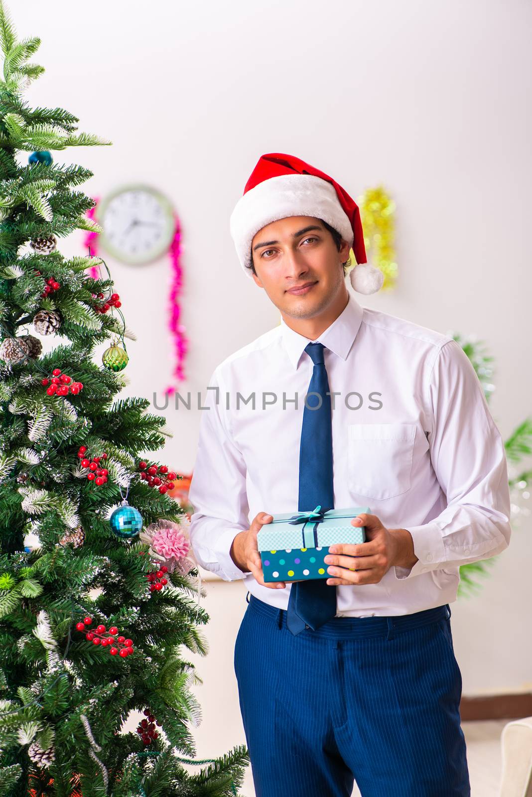 Employee businessman celebrating christmas in office