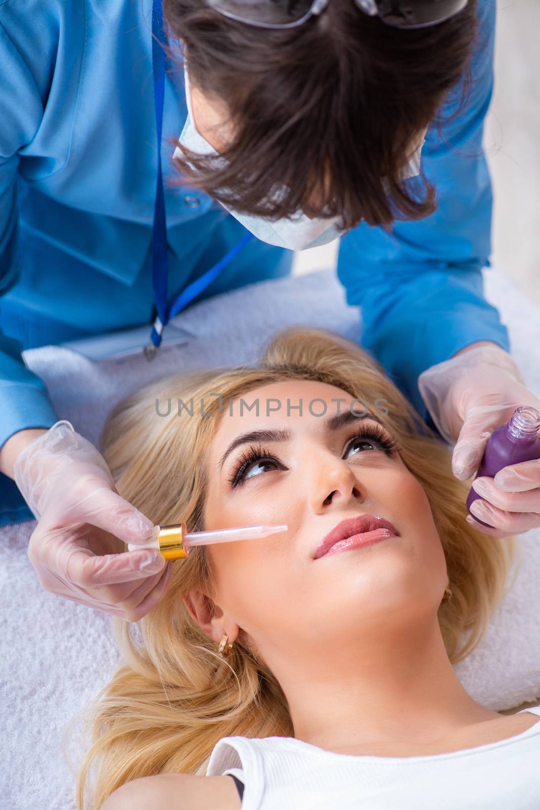 Woman visiting doctor cosmetologyst in beauty concept 