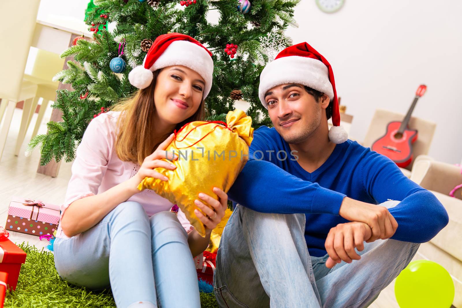 Young couple celebrating christmas at home