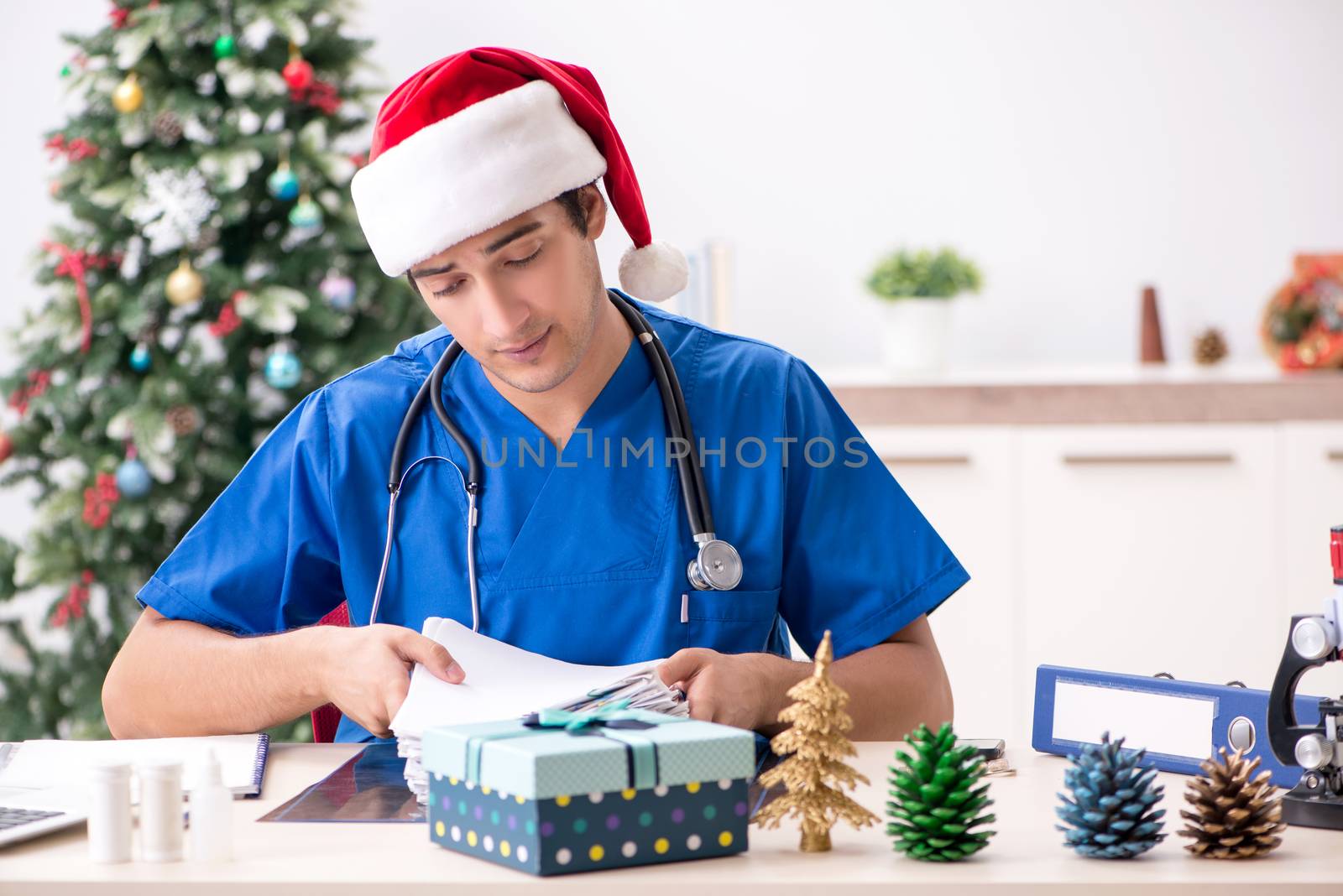 Doctor with gift box in the hospital