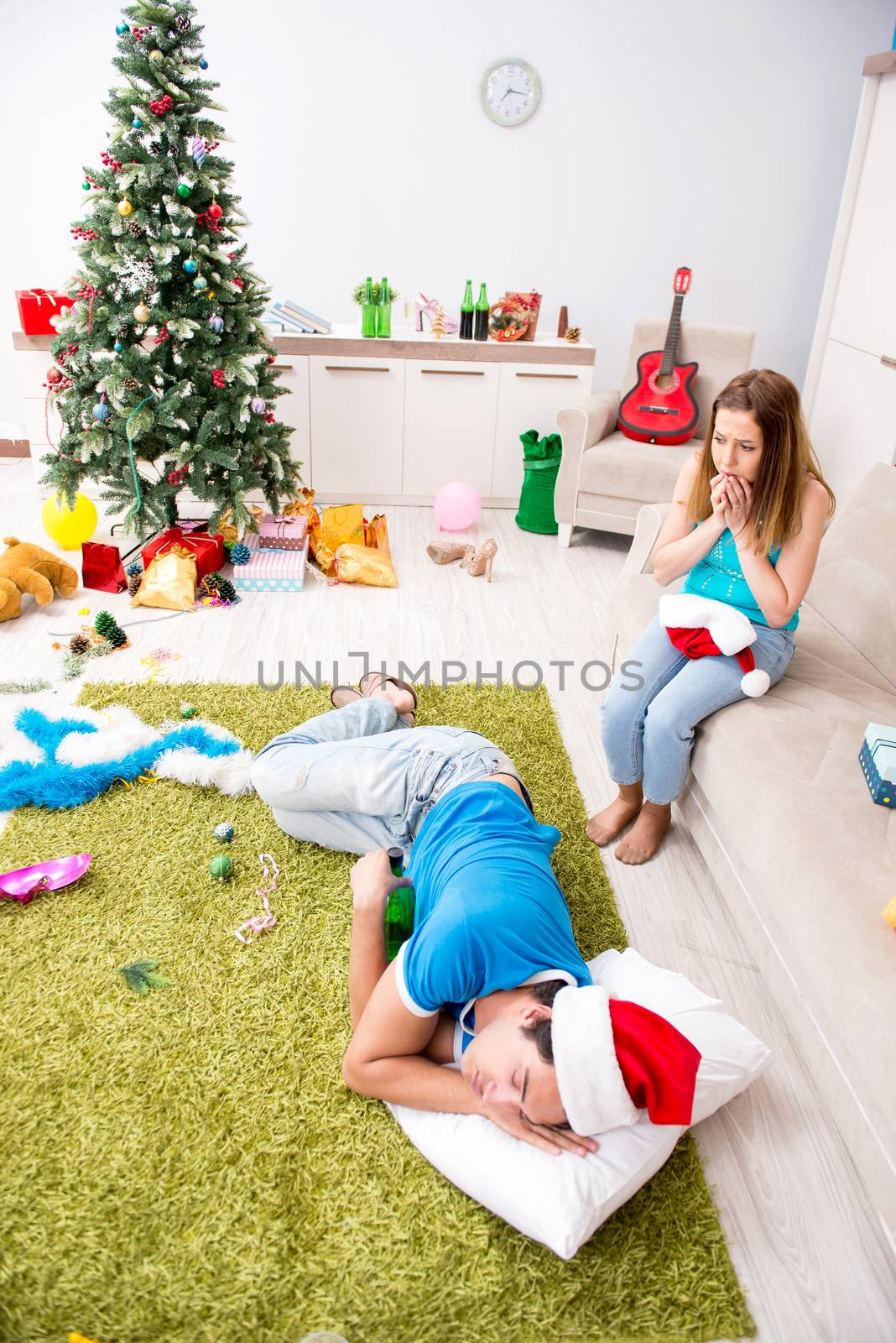 Young family celebrating christmas at home
