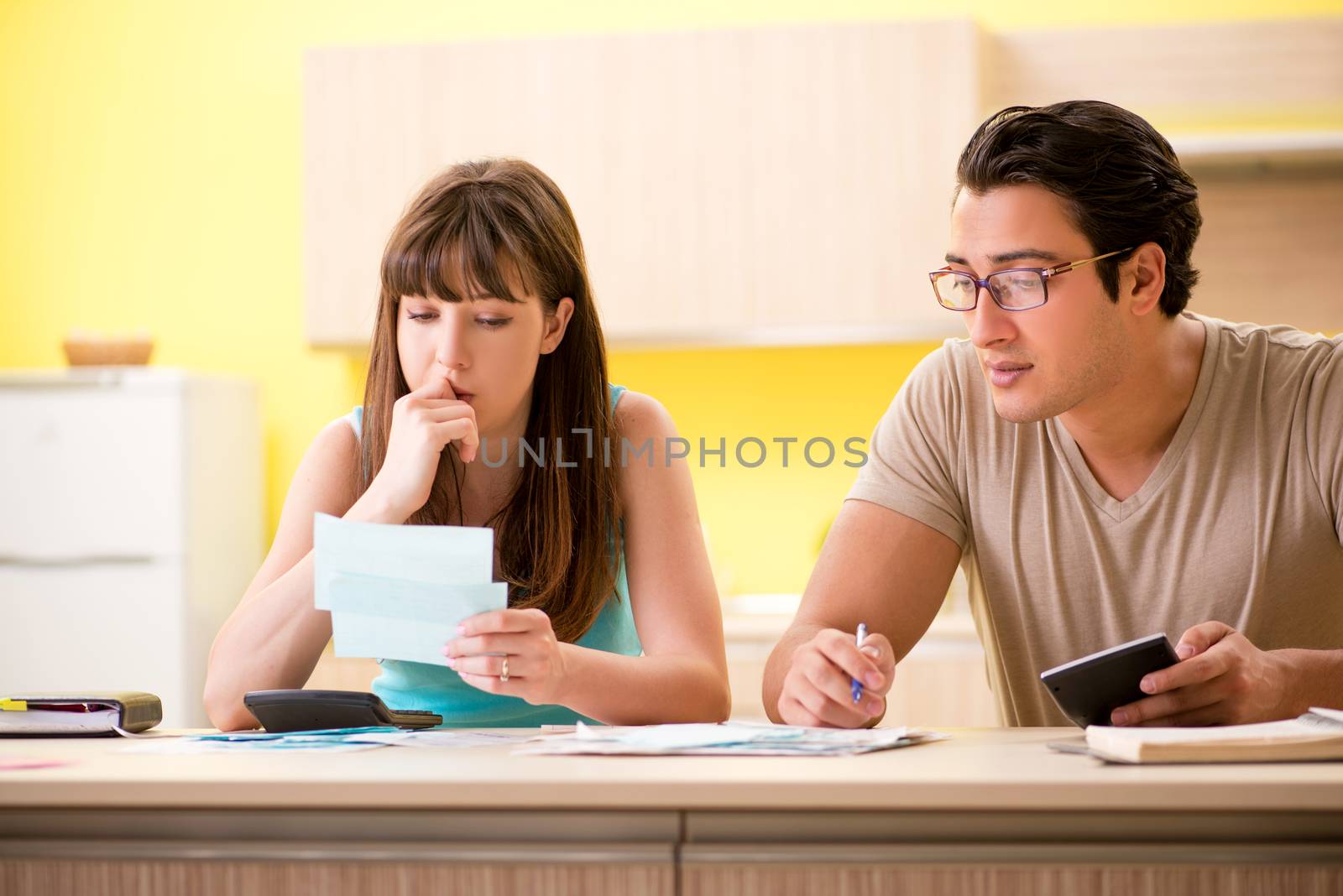 Young family struggling with personal finance by Elnur